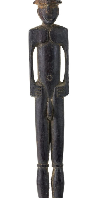 001932 Papua, Lake Sentani, lick stick